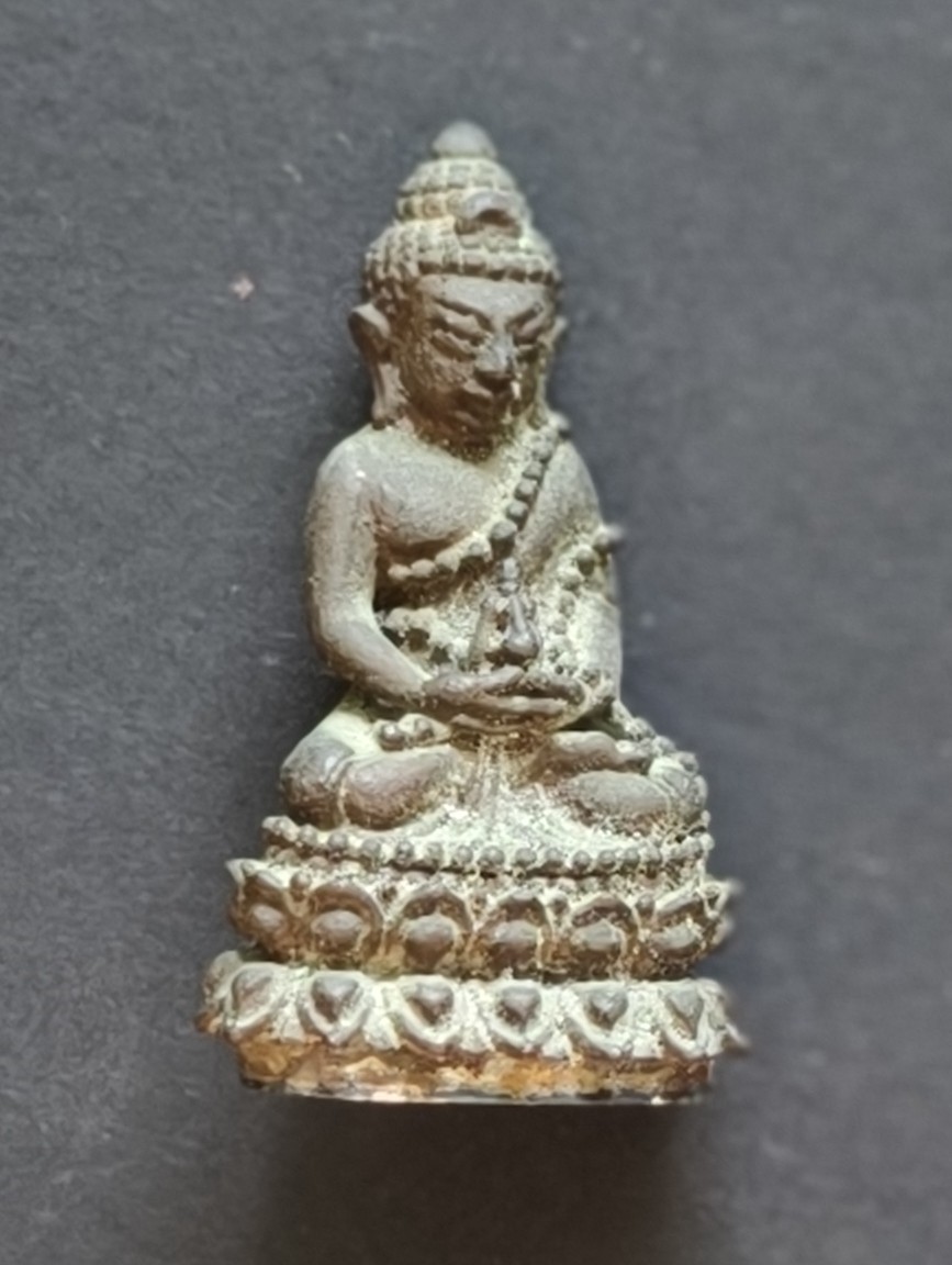 A seated Buddha in meditation posture